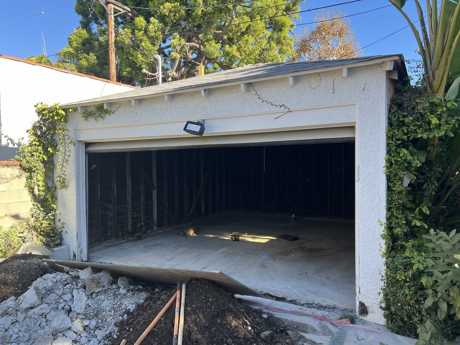The detached garage from the driveway before the conversion started