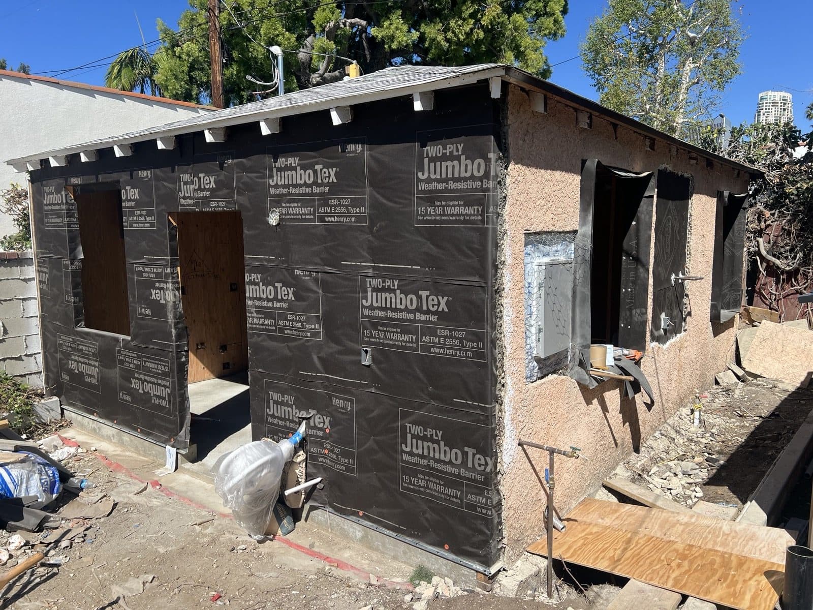 Weather-resistive barrier wrapped over the exterior before stucco