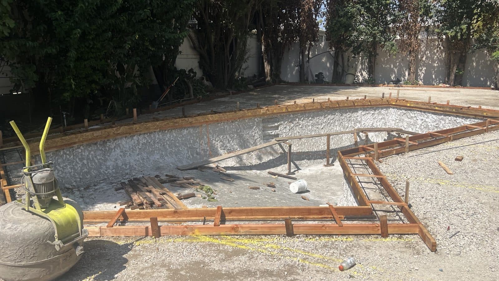 Foundation forms and rebar laid out across the prepared site