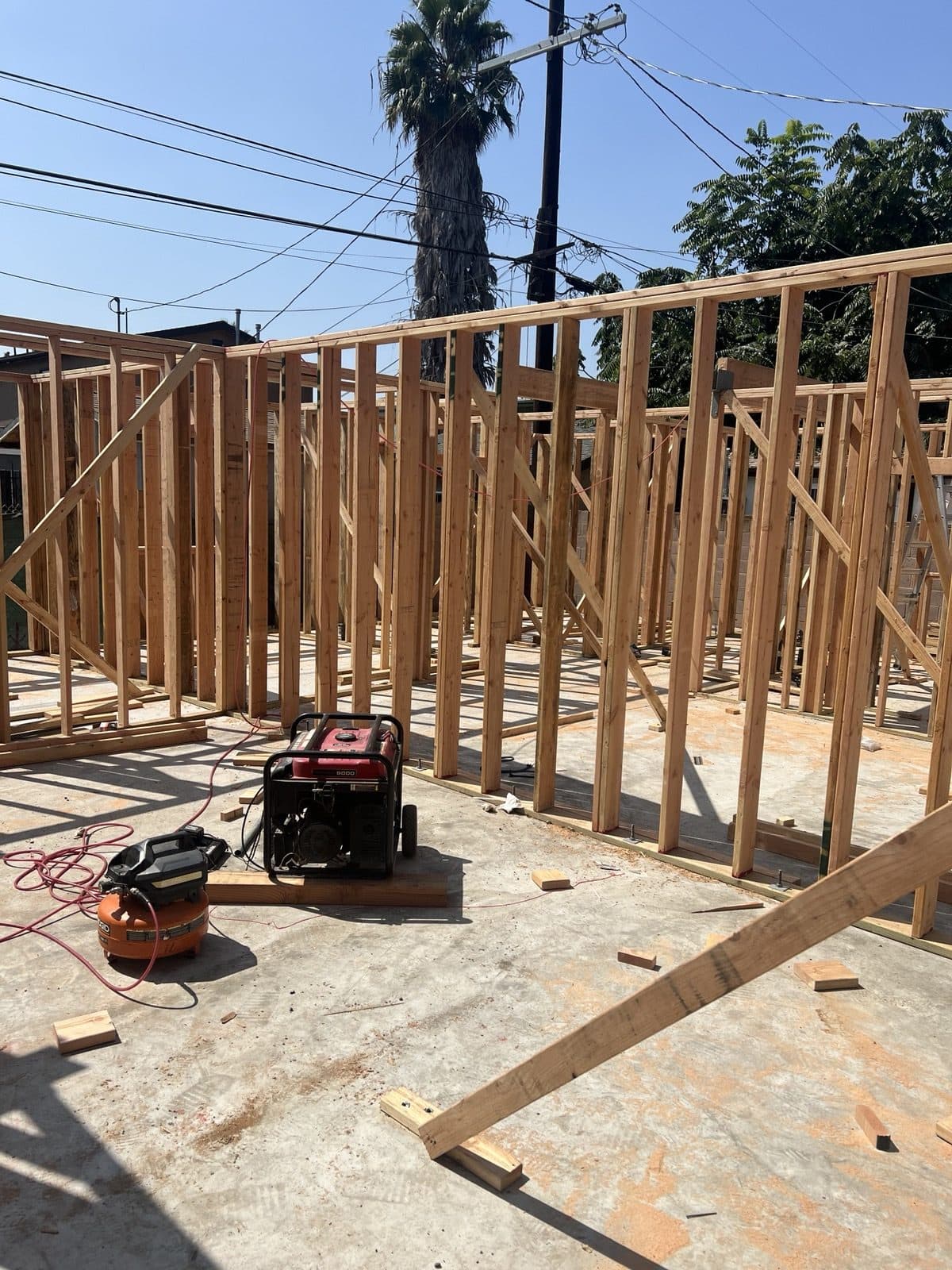 New wall framing standing on the slab with bracing in place